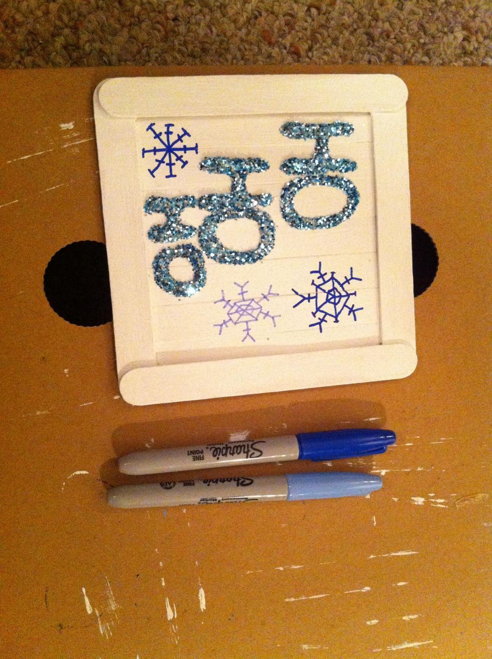 I used Sharpies, but you can use paint pens too. Draw some seasonal pictures on your sign. I chose snowflakes!
