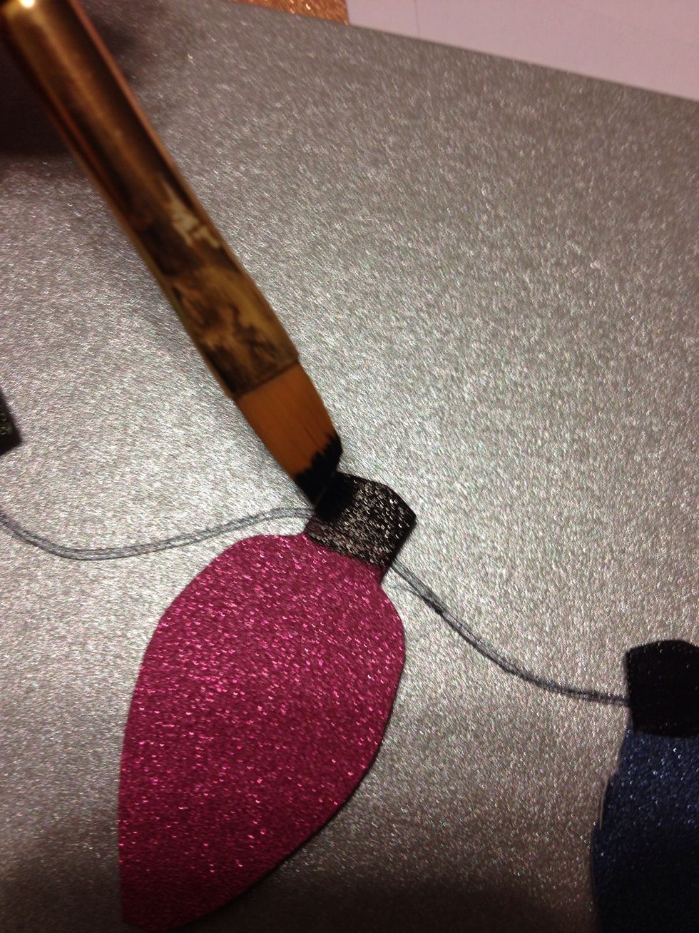 I used some black paint to creat the cap of the lightbulb. Let paint dry for a few minutes.