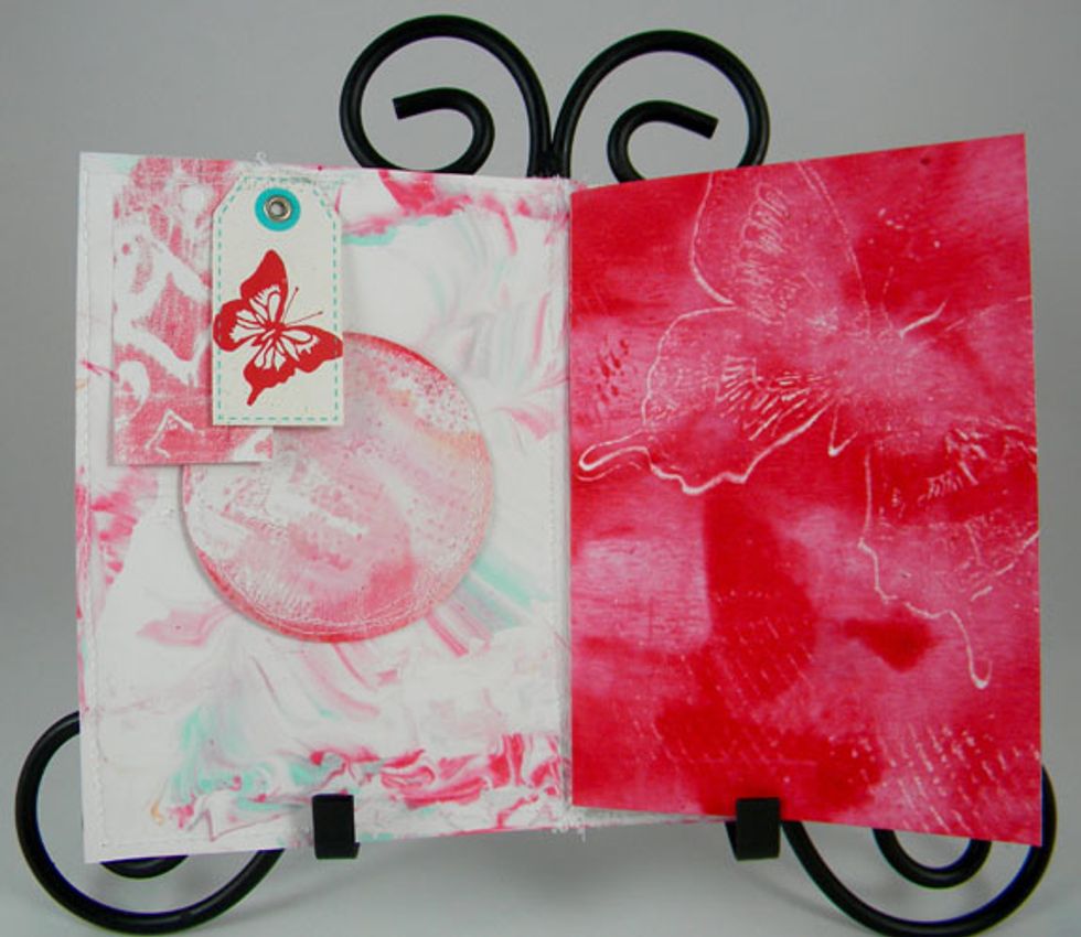 I used some of the prints that I didn't like to die-cut circles and tags and glued or sewed them into the books.  Each journal is totally different.
