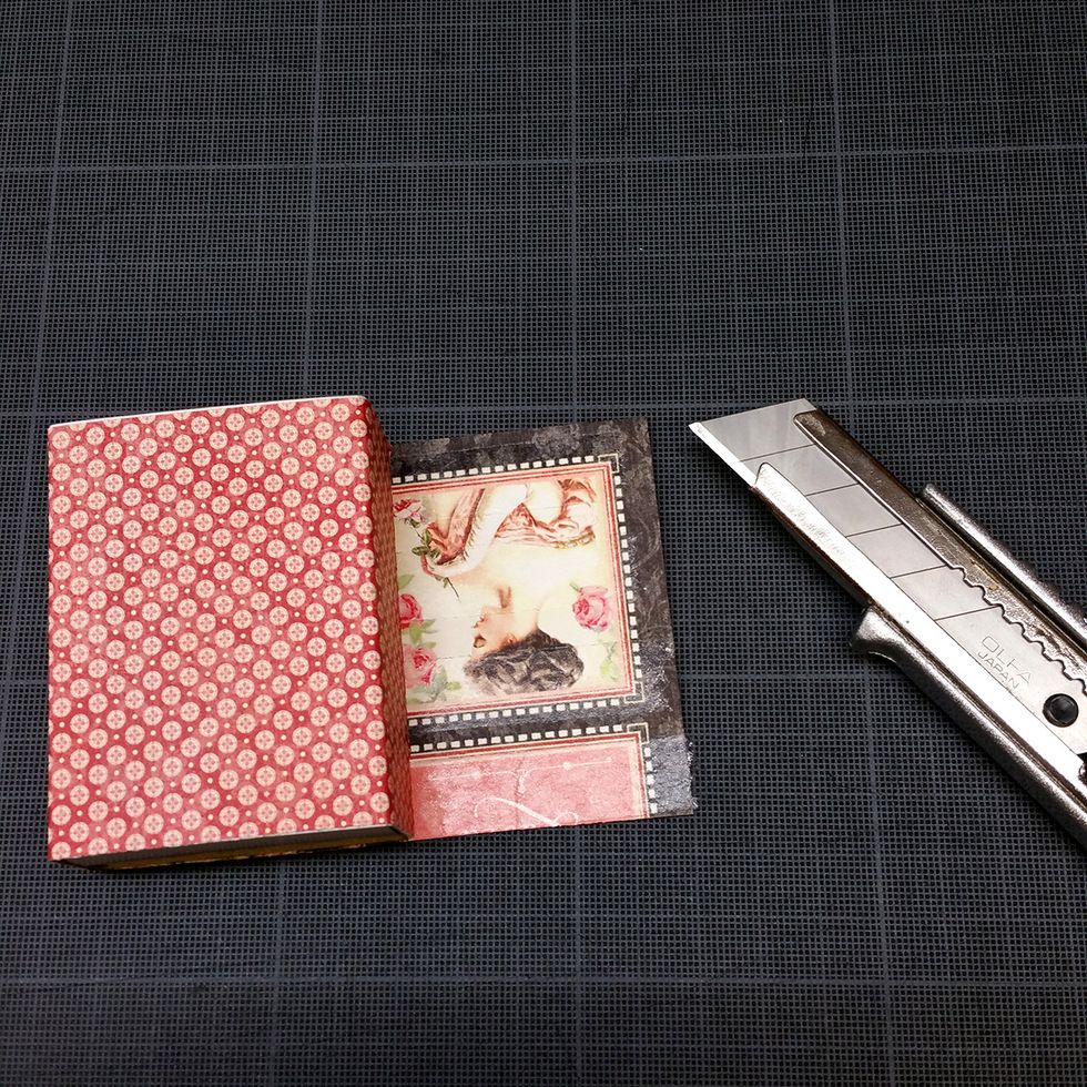 I used strong glue, and glued it to the box. Then I just cut of the piece of paper that was left over.