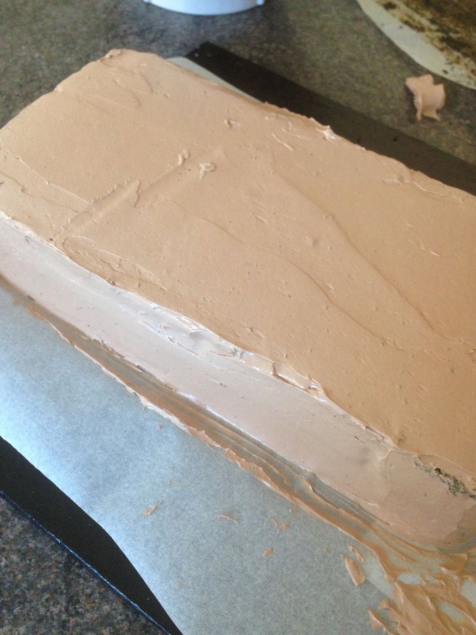 I used Swiss meringue chocolate buttercream to sandwich the two layers and frost the cake. Tip: using strips of parchment paper helps keep the base tidy. After frosting, just remove the paper.