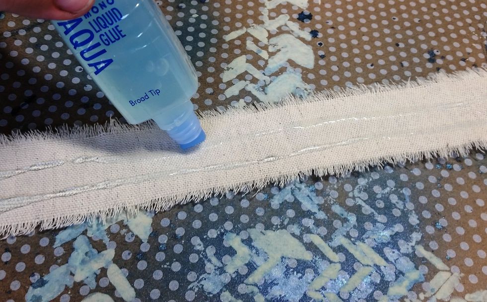 I used the Tombow Aqua Mono Liquid Glue to glue all the embellishments to the page including the chipboard, fringe, and cardboard.