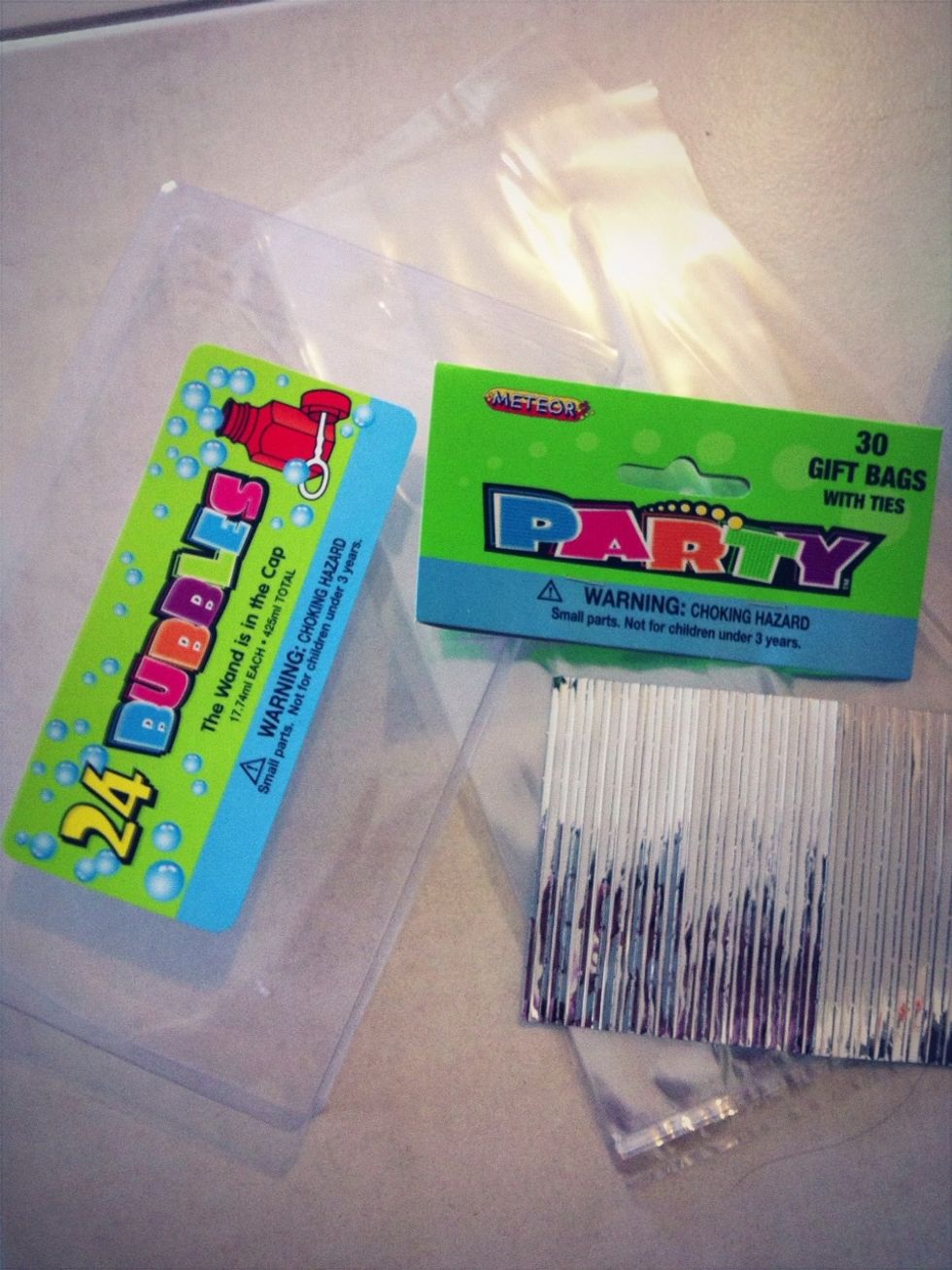 I used these party supplies, cheaper when in bulk and chose to use; bubble party favours multi colours, party bags and they come with twist ties.