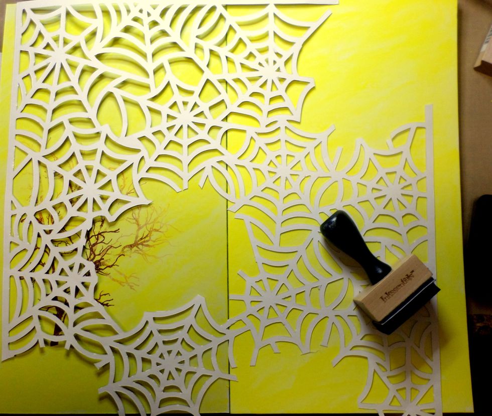 I used this spiderweb paper a stencil. I didn't want it behind my tree so I left some areas out. I used black ink and I pounced it through the paper/stencil.