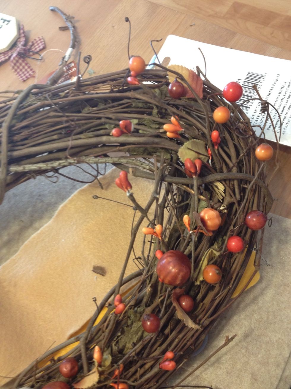 I used three of the garland branches for the upward section of the wreathe from the flowers.