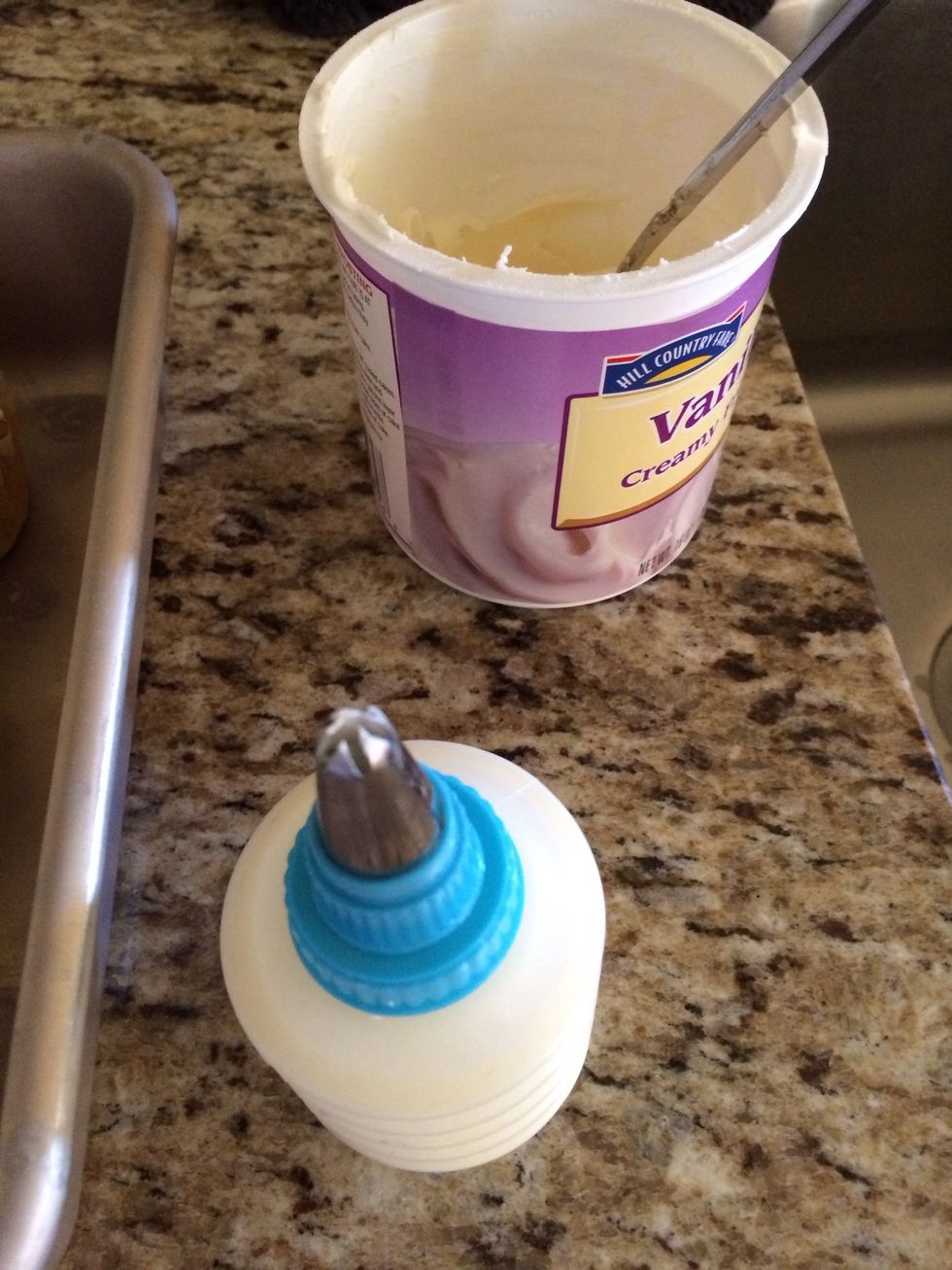 I used vanilla frosting but you can do cream cheese, chocolate, whatever floats your boat. I loaded my frosting into my gadget I got and used a star tip to frost.