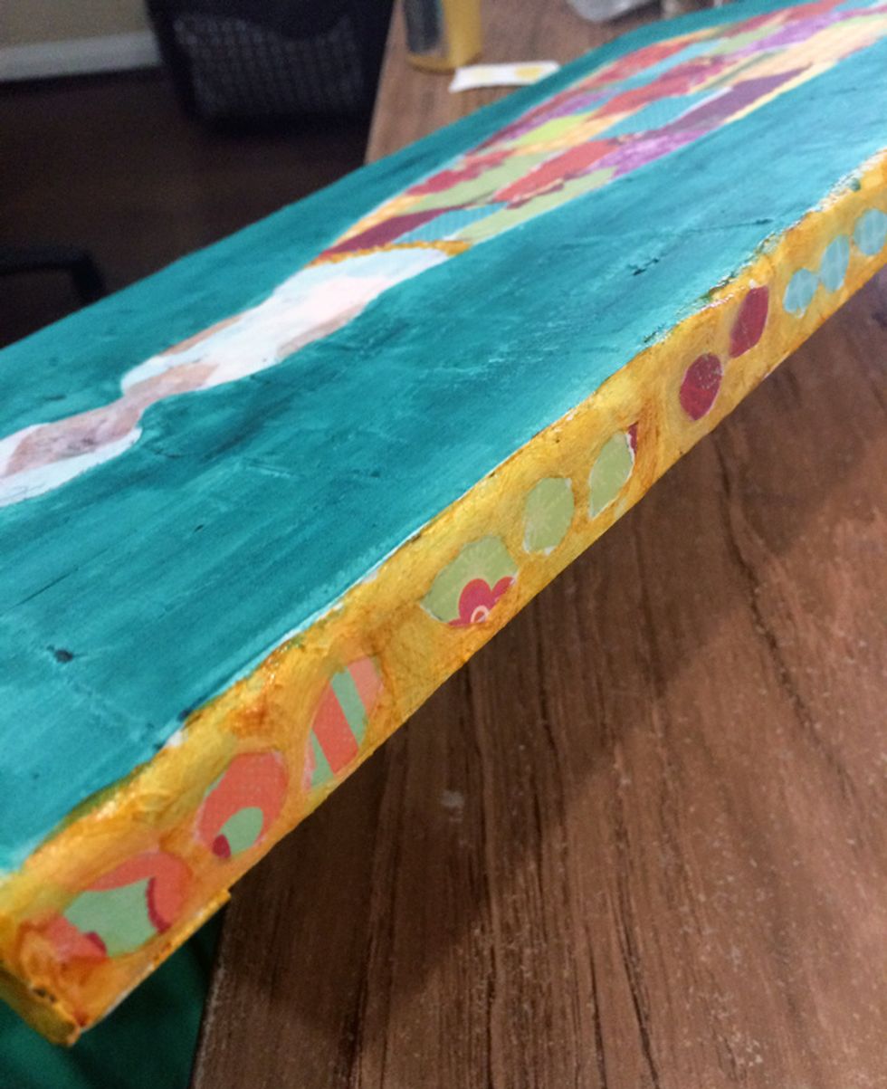 I used Vegas Gold Sorbet to paint around the flowers and leaves on the edges of the canvas.