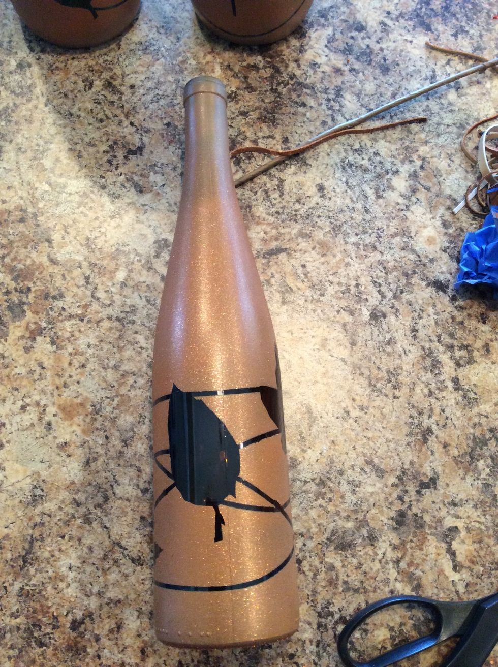 I usually cut the rubber bands so I don't scratch the paint. Don't leave the paint dry on the tape and rubber bands too long.