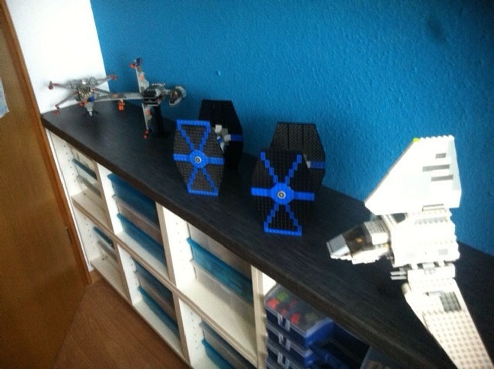 I usually had my LEGOs stored is a large sideboard in several boxes. That meant: Every time I wanted to build something, I had o take them out, put them somewhere and put them back afterwards.