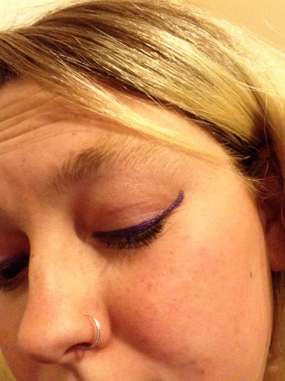I've added my first line of eyeliner as a starting colour using the Bold Purple liner. Follow the top of your lid above your eye lashes. You can flick out at the ends to create an Egyptian esque look.
