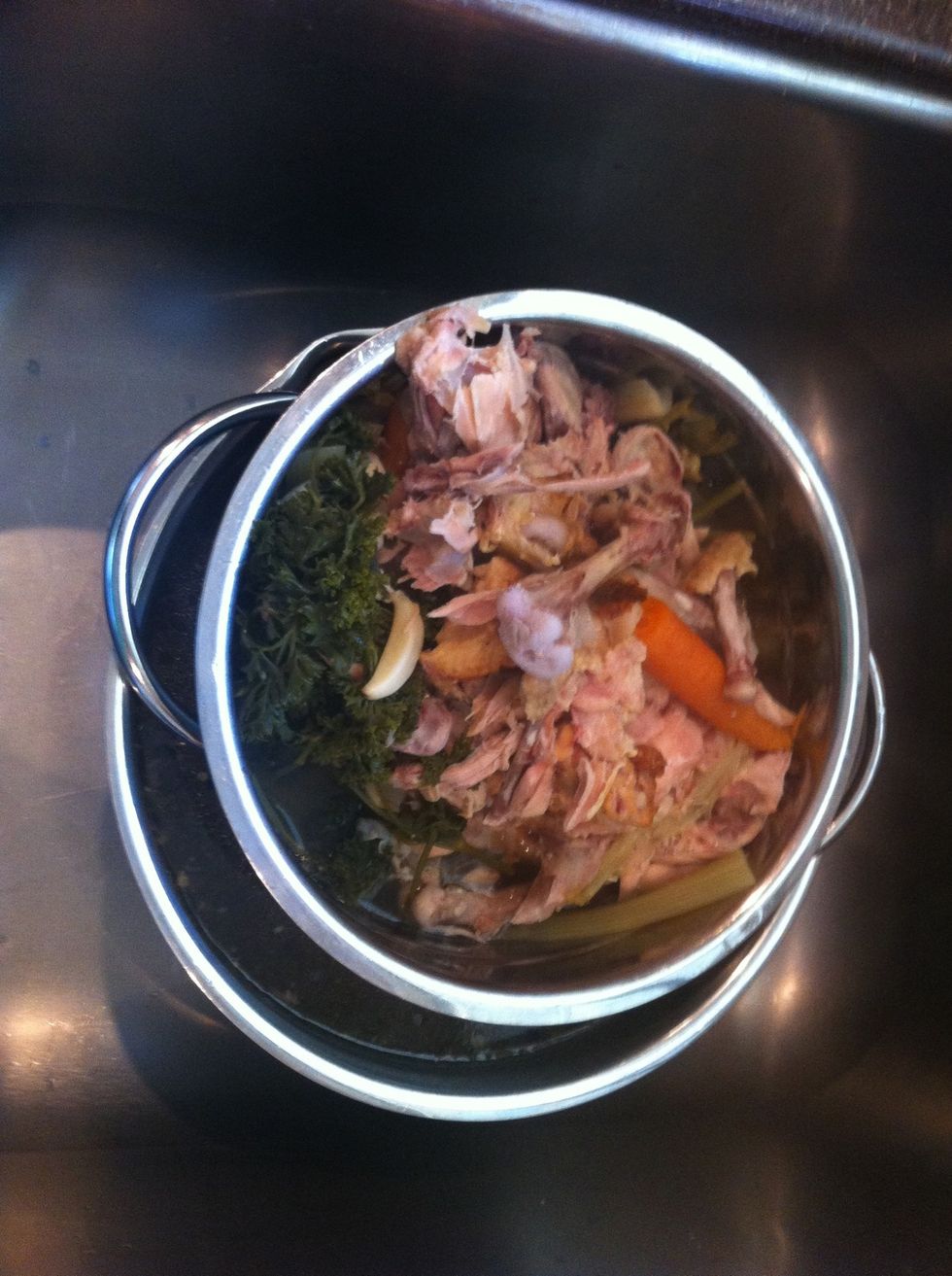 I've found that the easiest way to strain homemade stock is using a colander over a large bowl in the sink.
