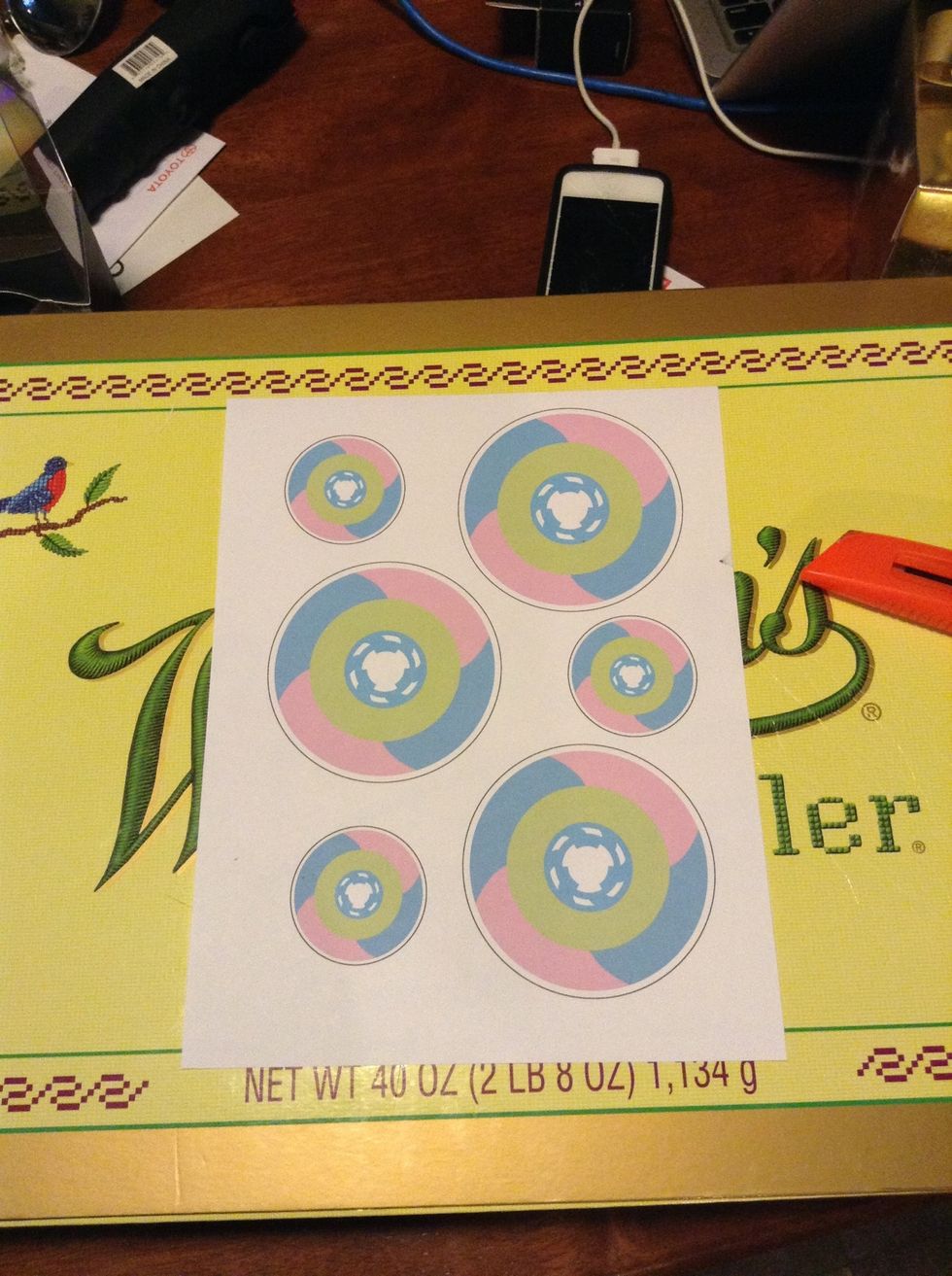 I've printed my sticker design in two different sizes thrice to make the most of the paper. The black outline is meant to help me cut later.