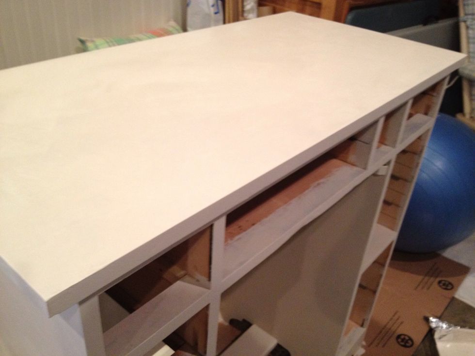 I've sanded top with a high # fine grit sandpaper between each coat. I've vacuumed away any dusty residue from the sanding before painting another coat.