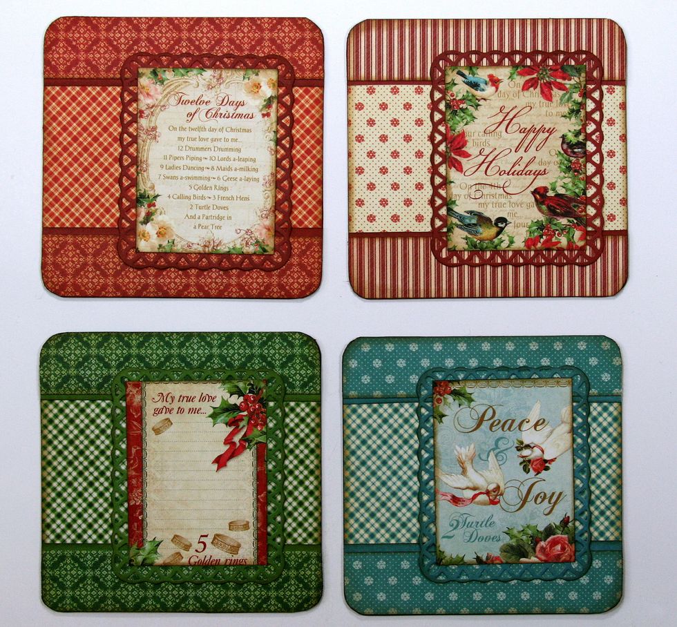I've trimmed images from the 8x8 paper pad and layered them over die cut frames in the same cardstock as the borders. Then added them to the ornaments.