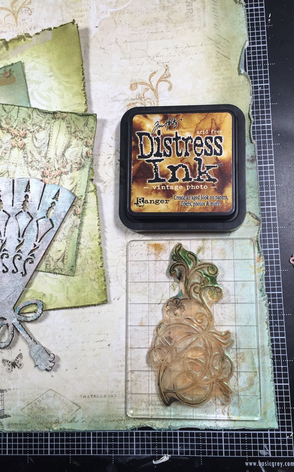 I want to add some more stamping before I glue down the rest of my layers so they are peeking out. This is an older Kaisercraft stamp, but I think any swirly stamp would work too.