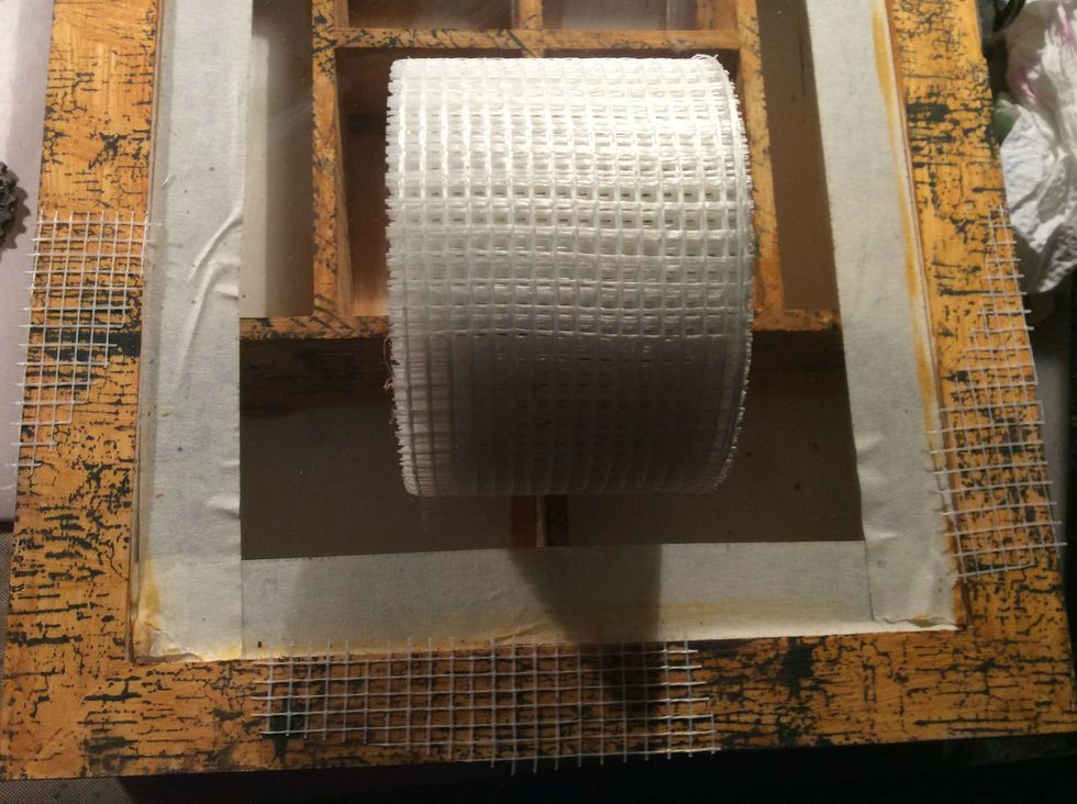 I wanted to add texture so I cut snips of this mesh tape I got at the hardware store and applied it in random spots. I also added Art Basics Graphite Texture Paste (not pictured).