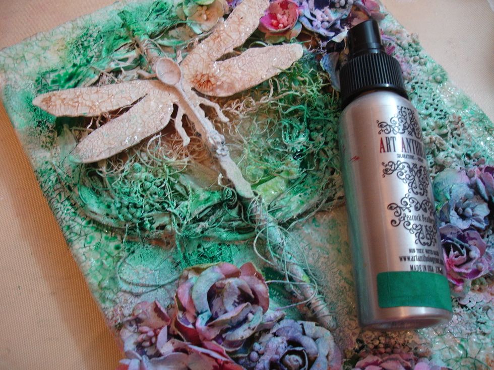 I wanted to deepened the blue/green color so I sprayed Peacock Feathers Colorations and heat dried it with my heat tool.