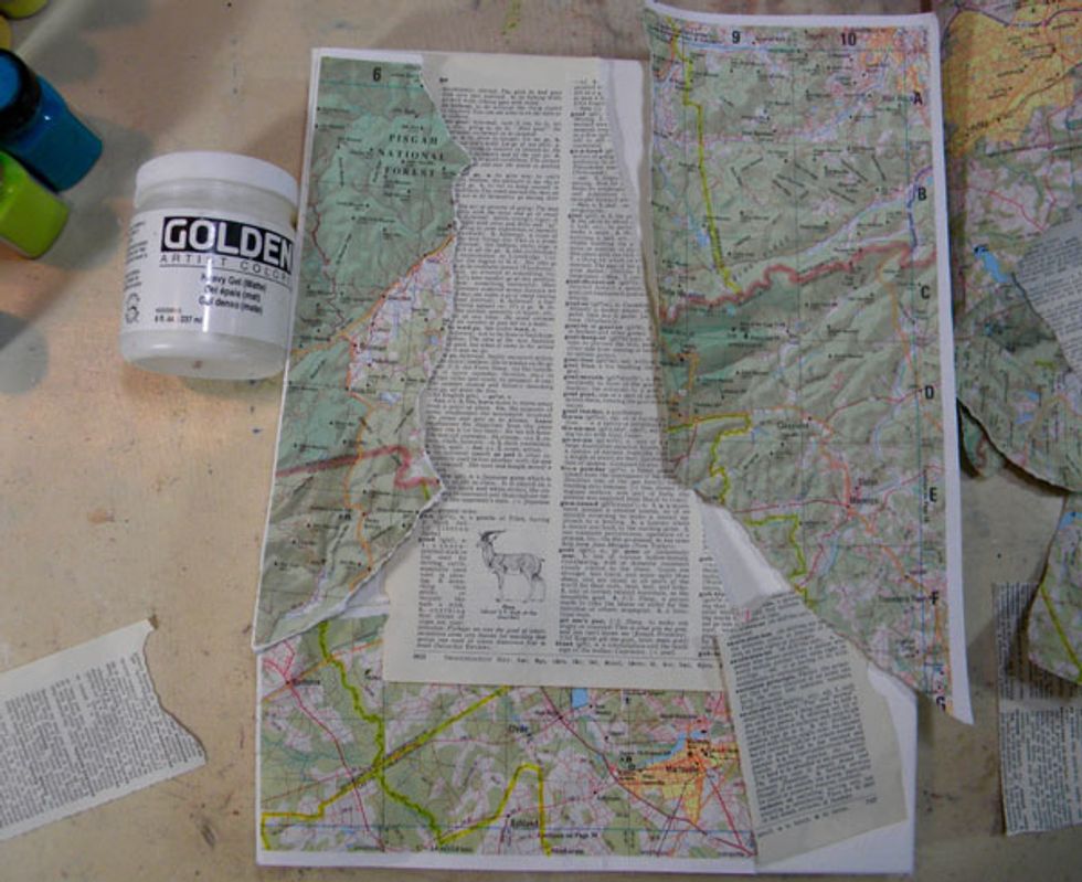 I wanted to use an old atlas page and some dictionary paper for my background. So I set my quote aside and glued down the paper using gel medium.