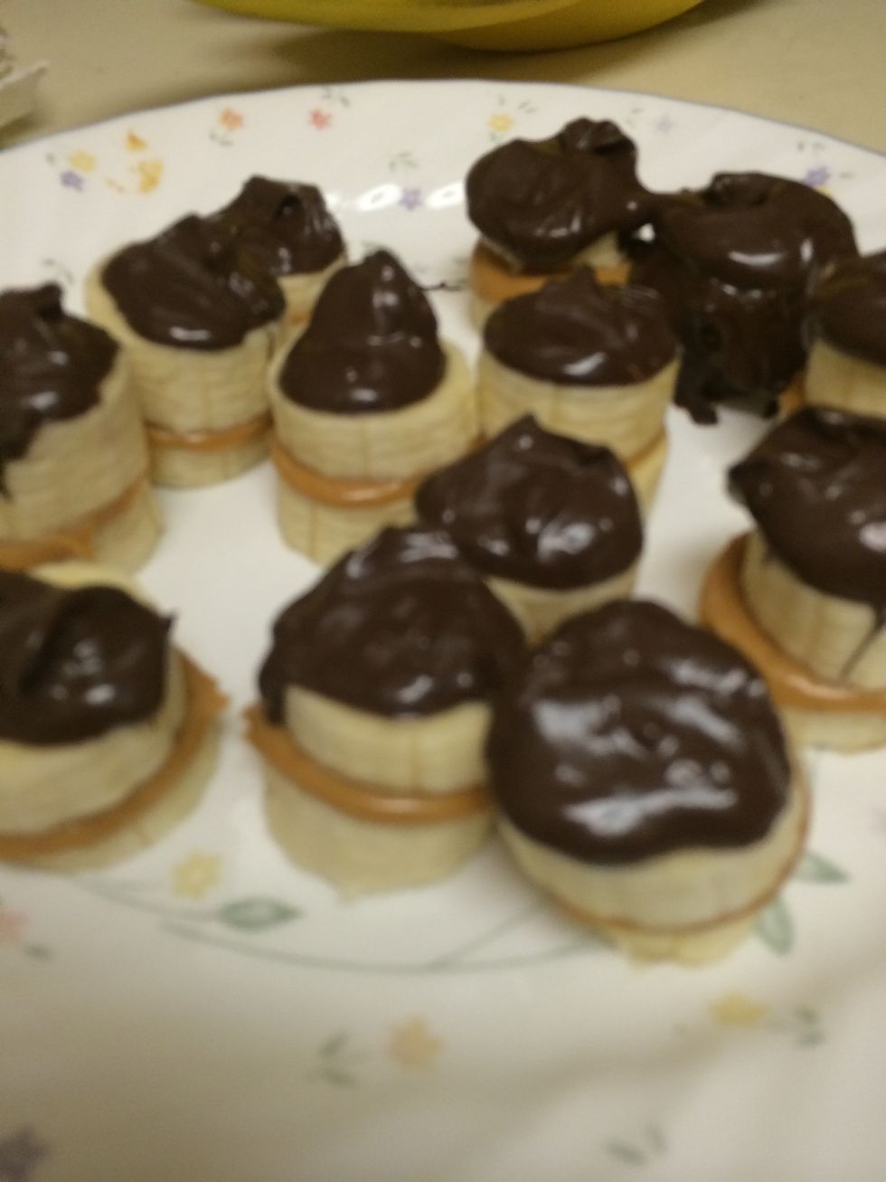 I was going to dip them but it would get stuck so I spooned the chocolate on top of each sandwhich!! And then I put back into freezer until stiff again!!