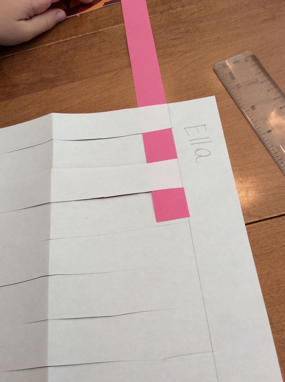 I weave the strip under and over, and under and over...all the way across.