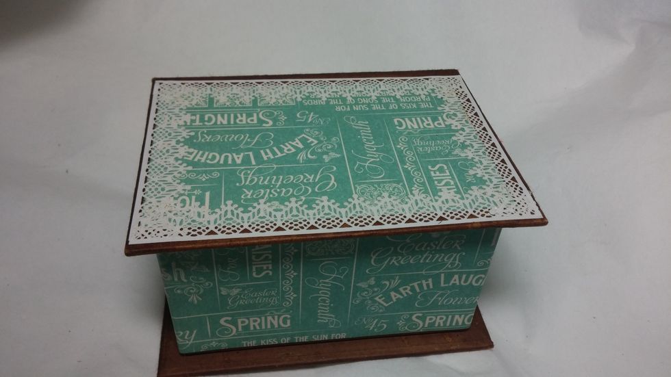 I went back to the outside of the box while the inside was drying. Layers of lacey edge stickers were added all over the box.