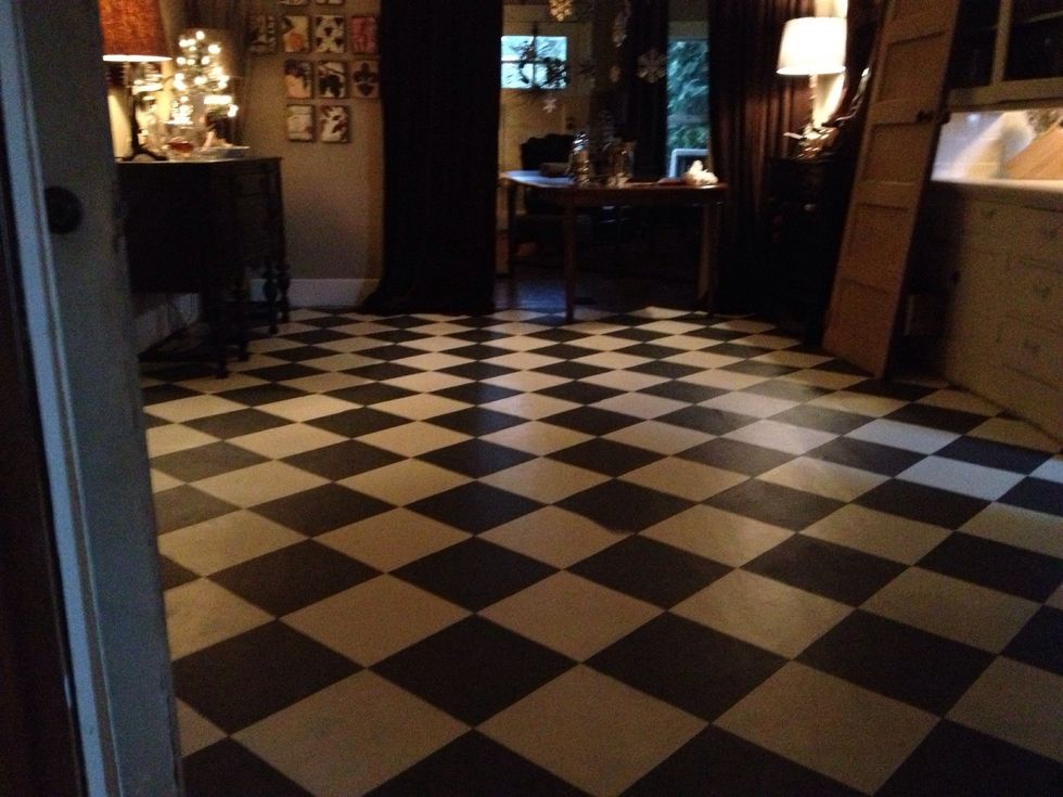 I went in with a fine brush & a straight edge to fix a few spots. But mostly my lines came out nice and crisp. I waited a week or so then painted the entire floor with a coating of polyurethane.