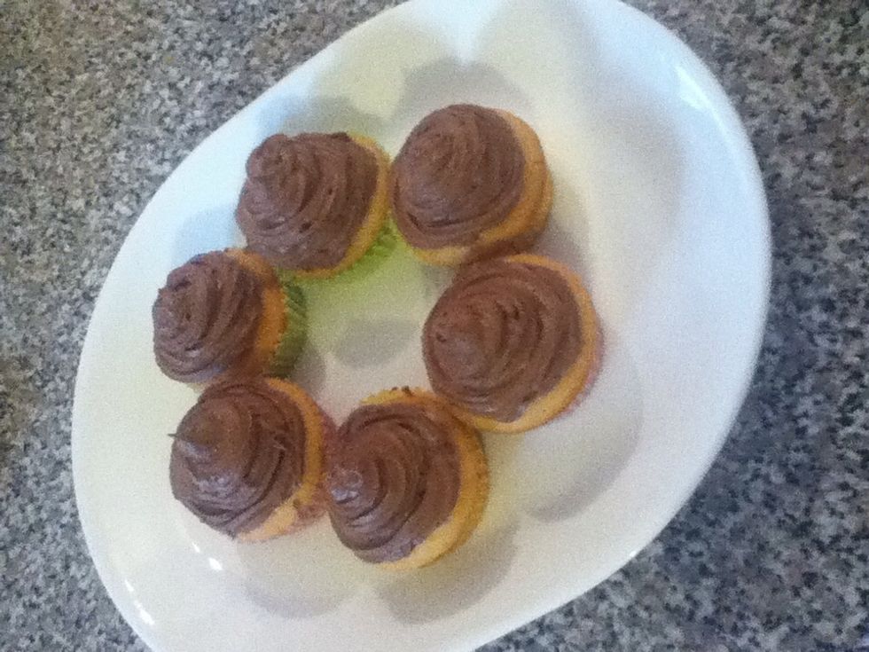 I whipped up a quick batch of chocolate buttercream and frosted mine :) they were delicious