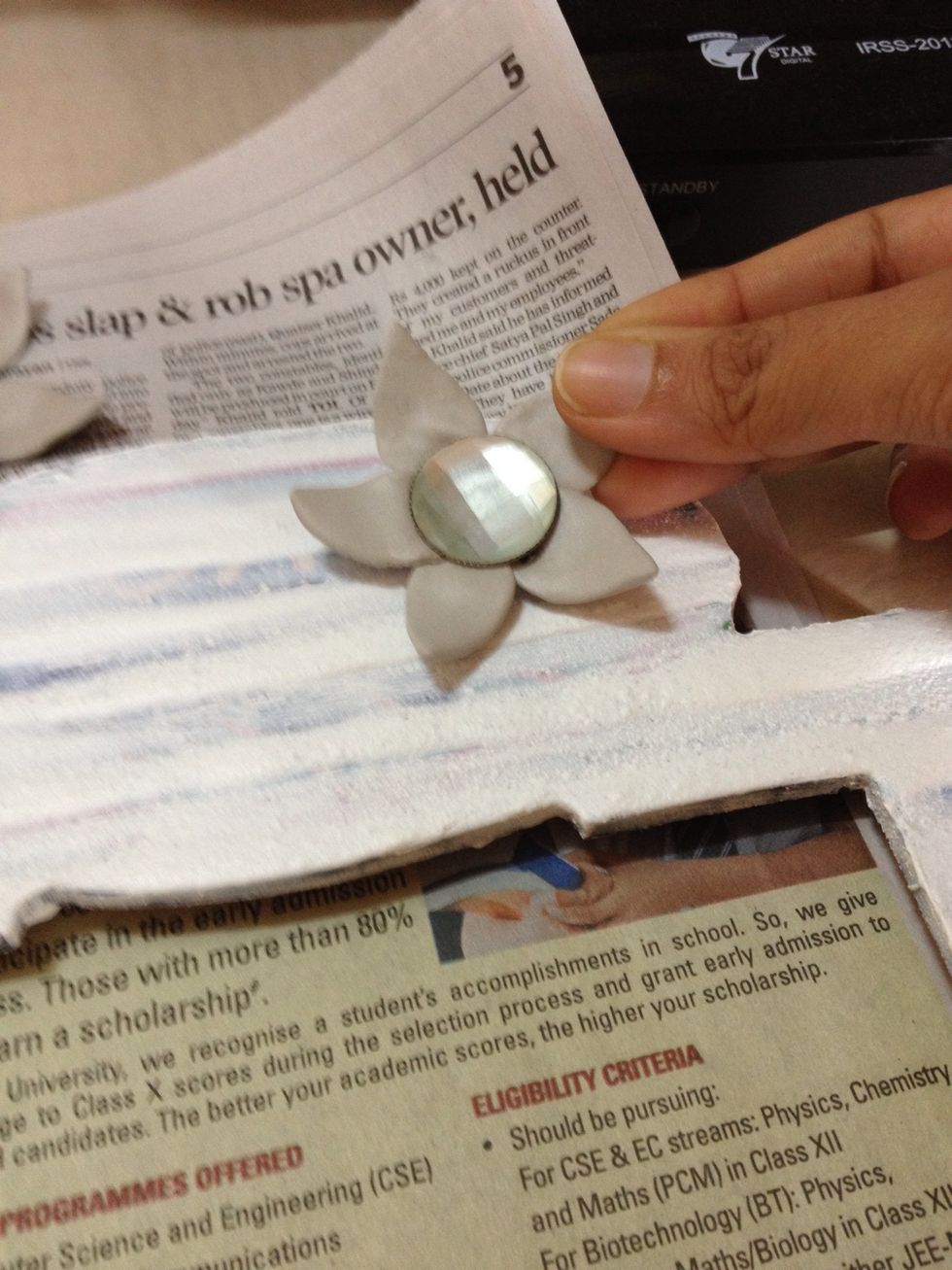 I will be using the same clay (m-seal in my case) to stick the flowers on the frame. Make sure you use a clay that binds and sticks well or else you can use a real strong glue.