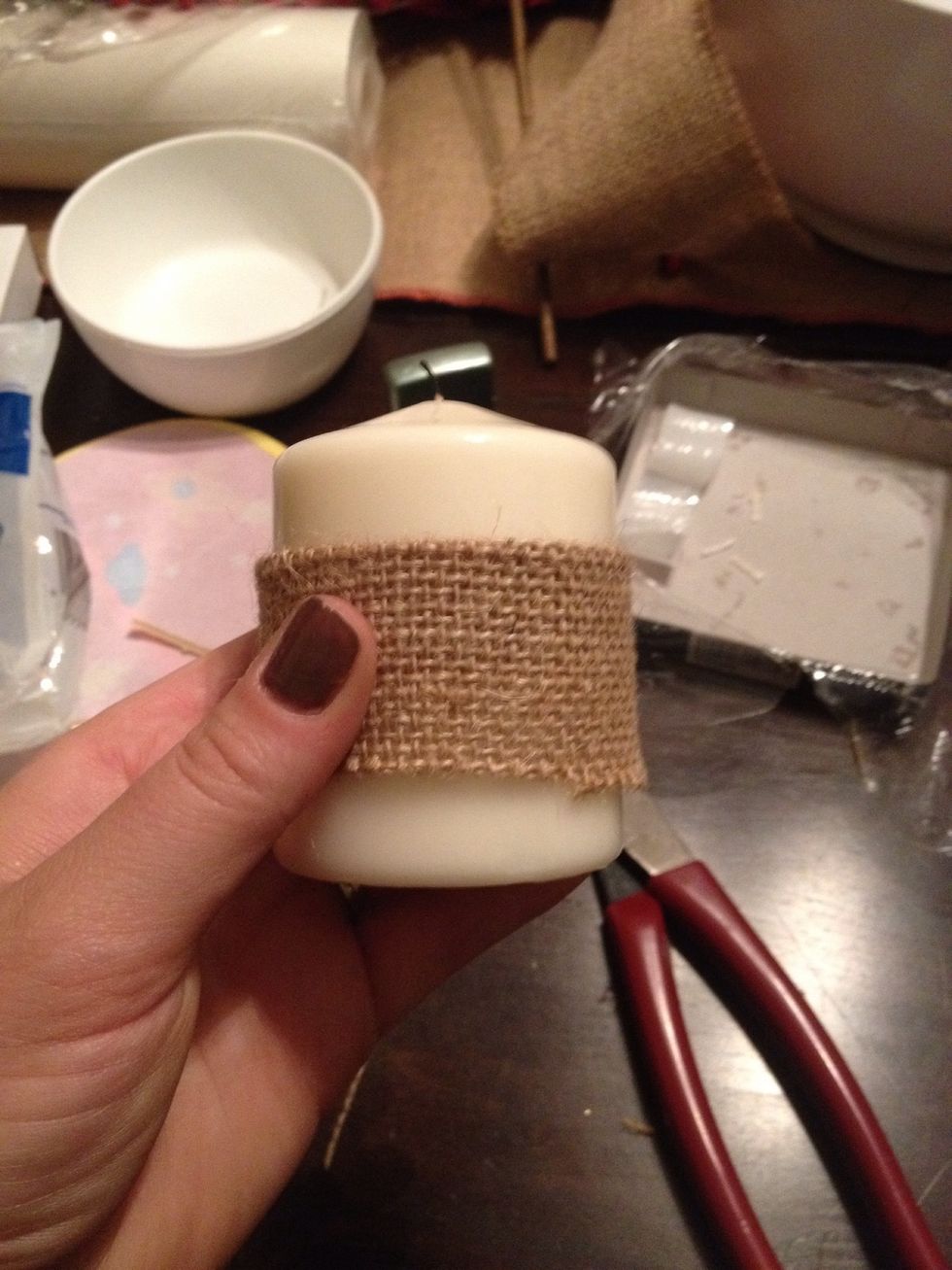 I wrapped the burlap around the candle and fastened it with a couple beads of hot glue.