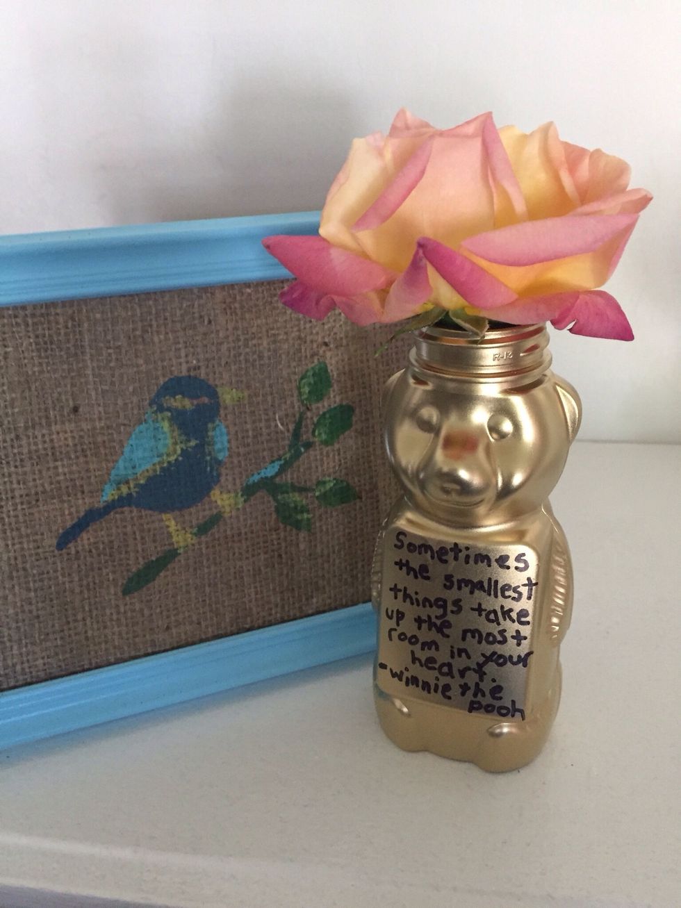 I wrote a little Winnie the Pooh quote with sharpie.  Fill with water and add a flower.