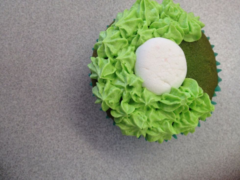 Ice around the cupcake with an icing gun