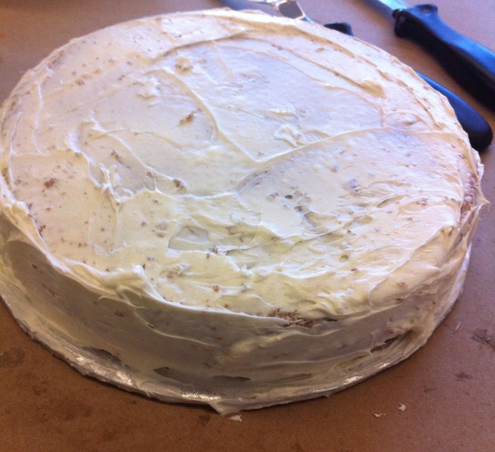 Ice cake with cream cheese frosting using metal spatula till covered. ( use your vanilla Duncan Hines cake)