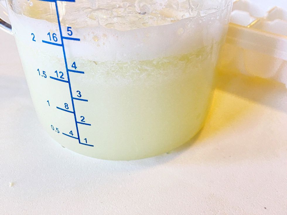 Ice cube tray sizes vary. Fill yours full of water and pour that into a measuring cup so you'll know how much you need to fill it. Empty the measuring cup and add your lime juice/fruit/pulp.