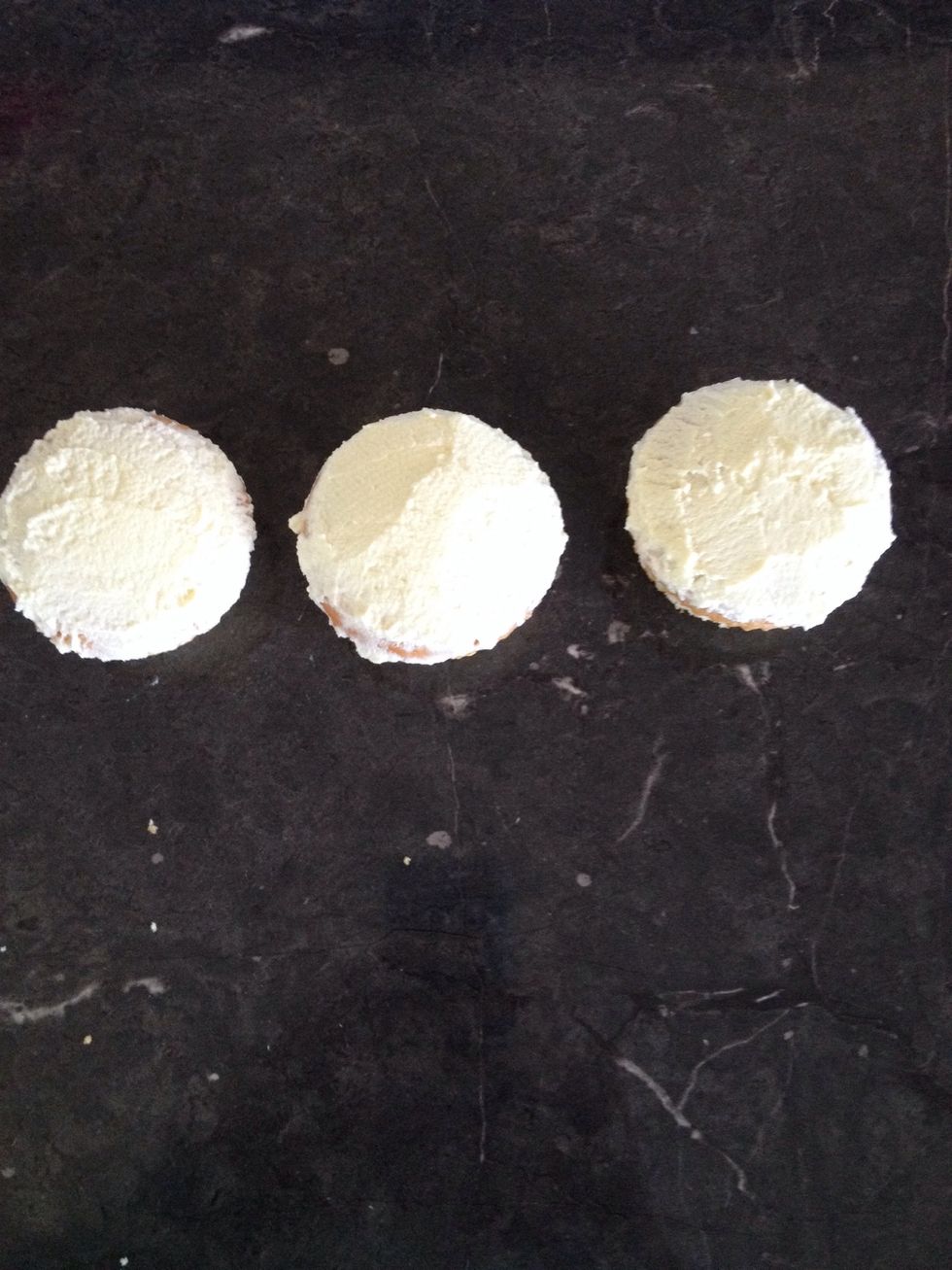 Ice three cupcakes with the white butter icing.