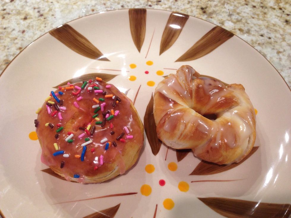 Ice with powdered sugar and water frosting. I added a bit of strawberry gelatin to the icing on the regular donut, and added maple flavoring to the icing on the cinnamon twist.