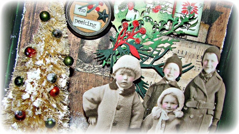 Ideology paperdolls were added with cardboard behind them for dimension. Distressed ink was applied to cheeks for color.