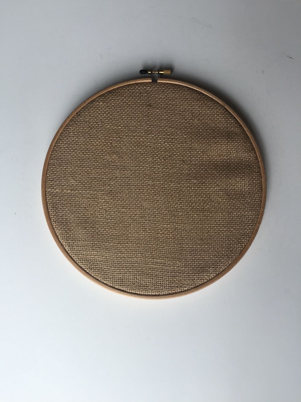 If adding burlap to your wreath, stretch and tighten burlap in hoop and cut off excess.