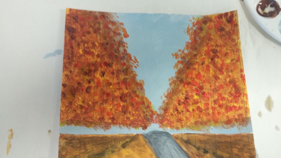 If applicable mix another color you see (like this red-purple) and dab and dot even less than the last in the leaves. This mix of colors adds more depth.