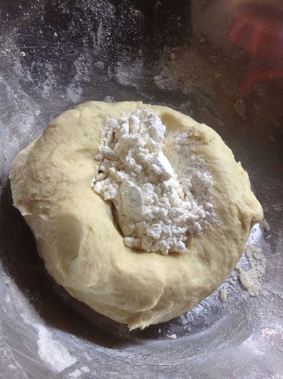 If by any chance it is still sticky add some flour  in the center and start mixing from the sides to the center.