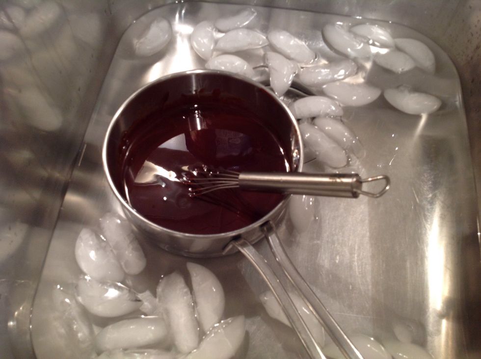 If here chocolate butter mixture hasn't cooled, stir it in an ice bath for a few minutes. You don't want it so hot that it curdles the egg mixture.