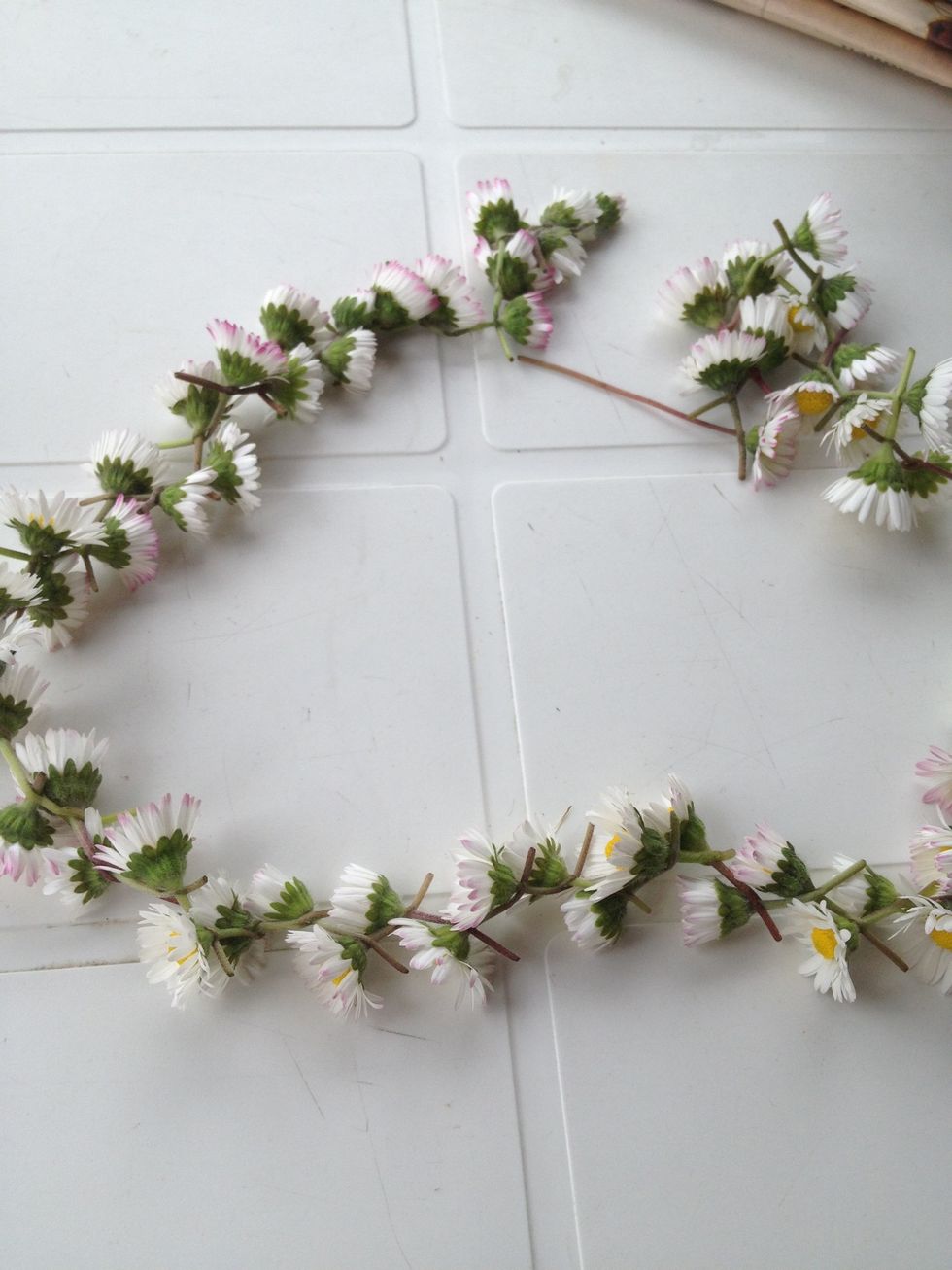 If it is long enough to fit around your head, twist both sides around each other.