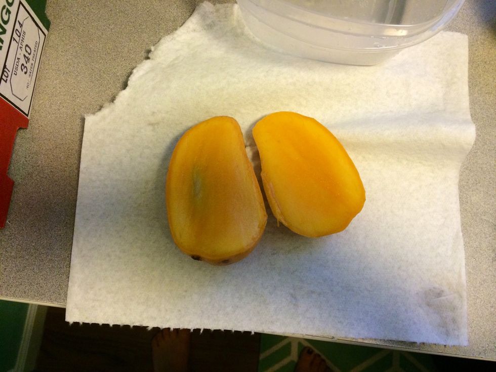 If it's a small mango (champagne or ataulfo) , discard the center. If it's larger, you can cut down the sides that weren't trimmed and skim the flesh from the skin.
