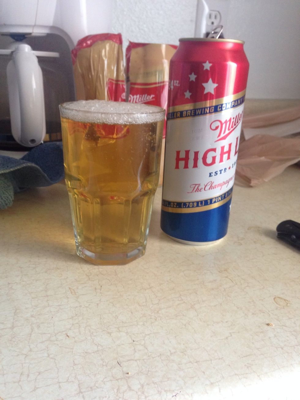 If it's beer, pour two thirds down the side of the glass while tilting the glass then straighten and swirl the rest in for a good pour.