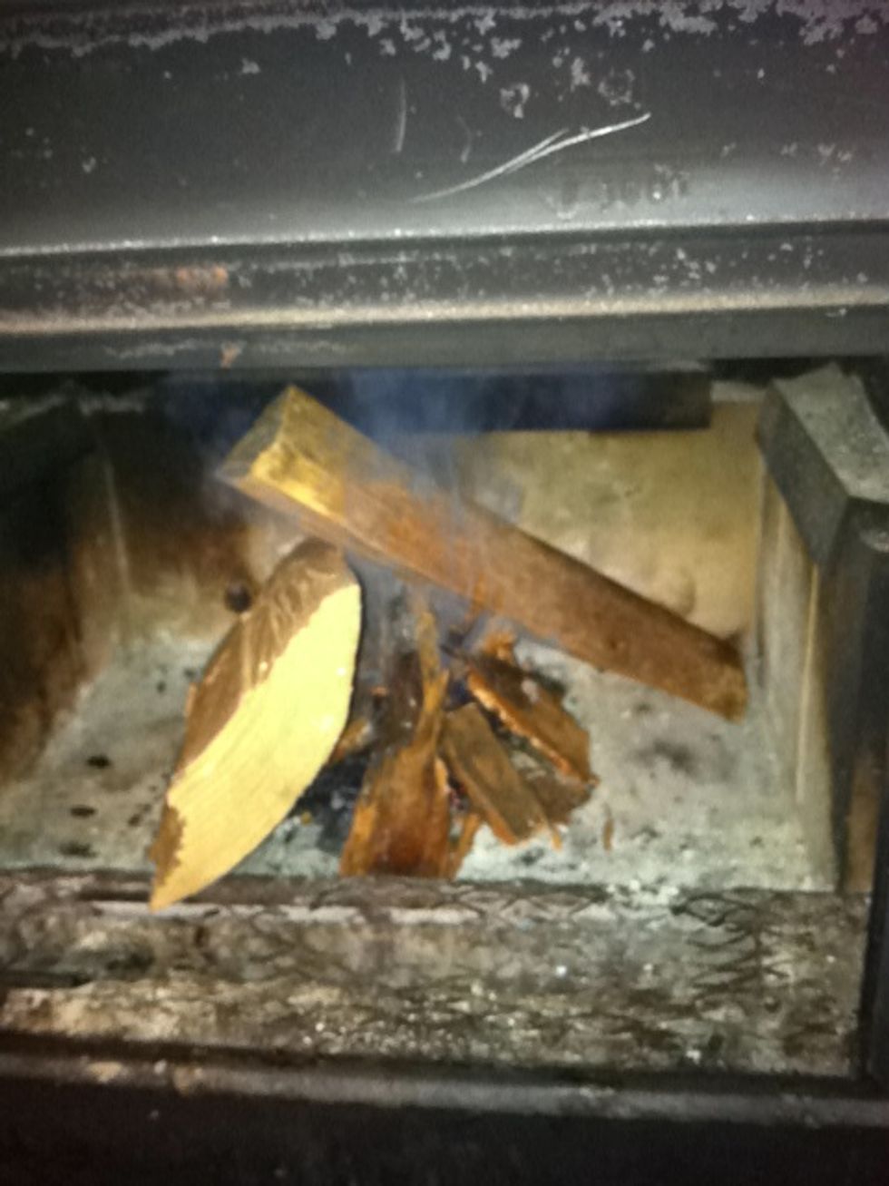 If it's smoking it's still lit but you need more oxygen. Blow as forcefully as possible (without blowing ash everywhere) into the base of the structure.