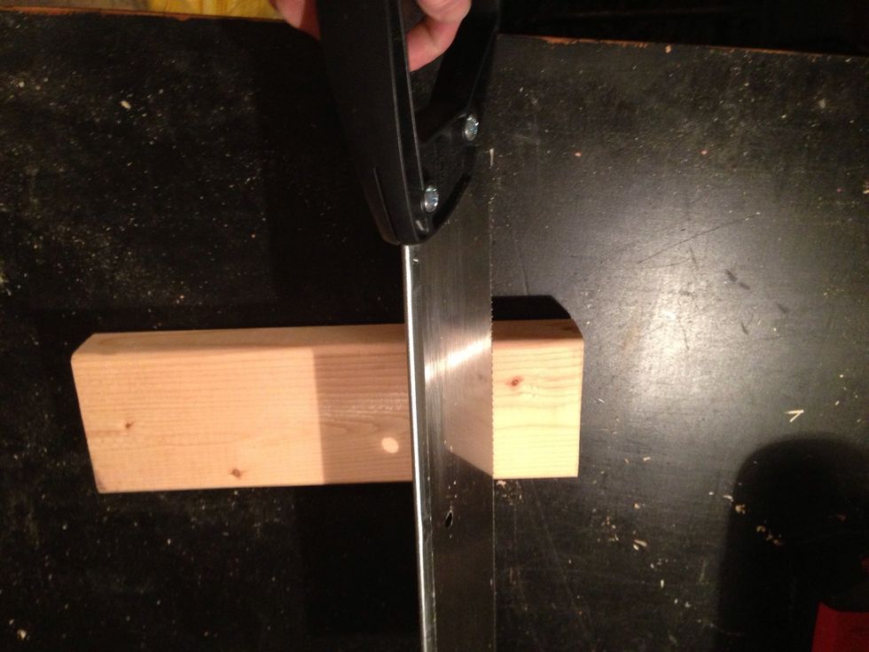 (If needed) saw your scrap wood into 2 small pieces. Mine are roughly 2" x 3" x 2"...