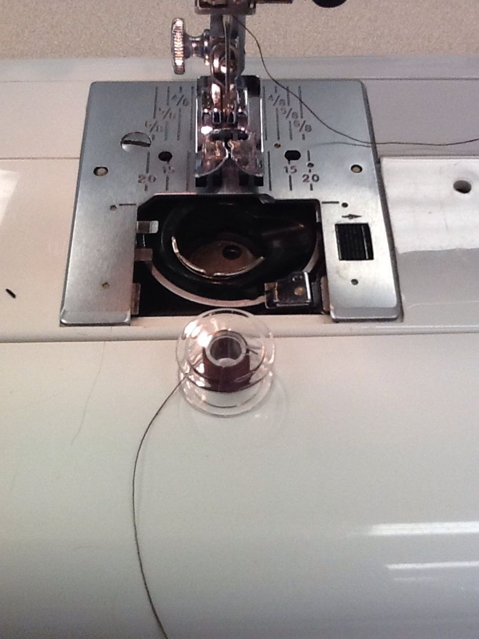 If not drop the bobbin in as it should look like a number 9 , feeding it down to the bottom and into the slot which will bring it towards the upper left of the dropping area.