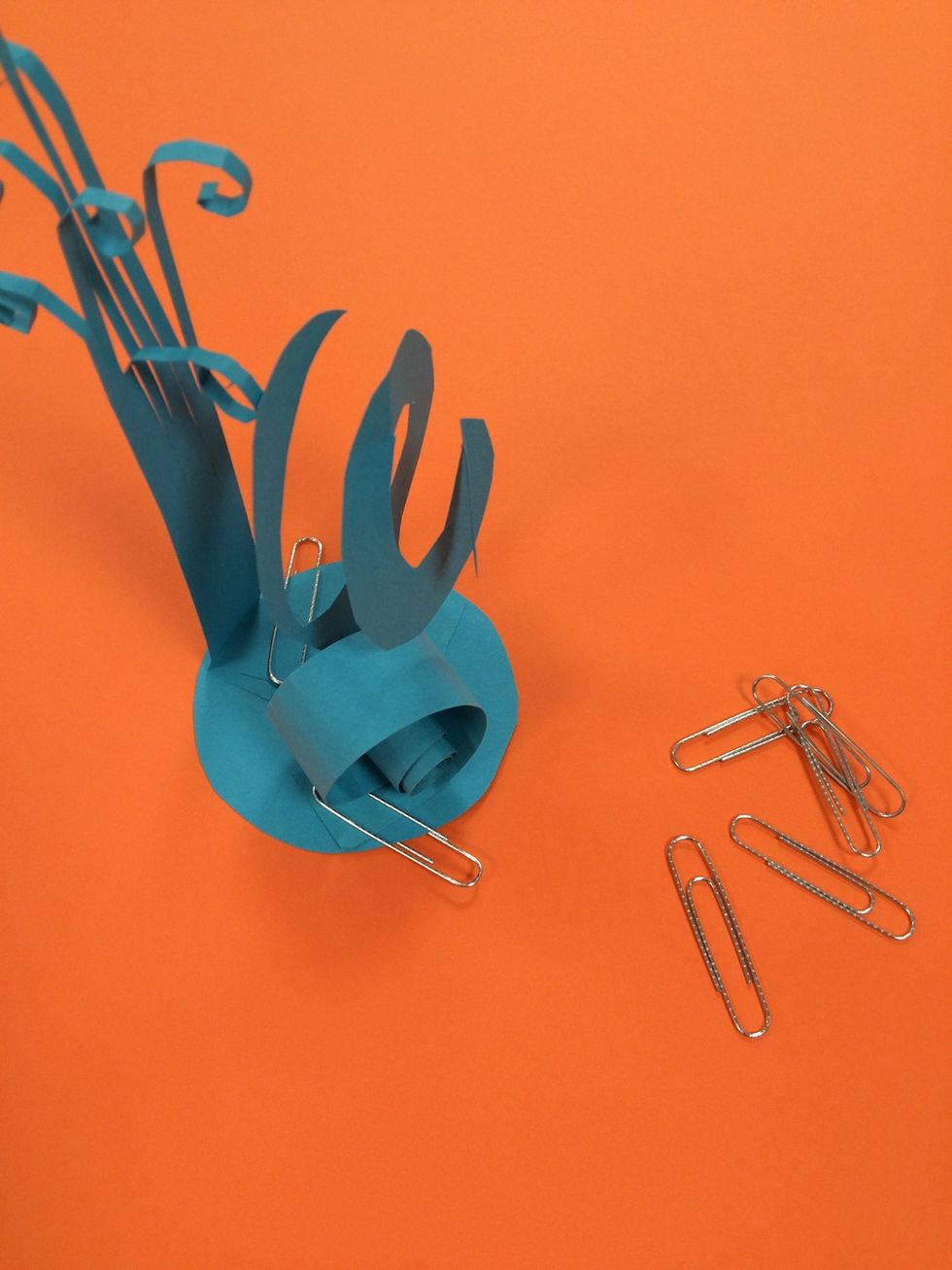 If pieces need a bit more support, you can use paper clips to hold them until the glue dries.