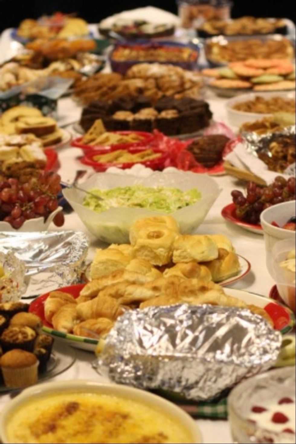If she had a big job to do on the farm, she invited everyone over that she knew.. laid out a big spread of food..fed them and worked together to get the job done. Home cooked food = Free Labor!