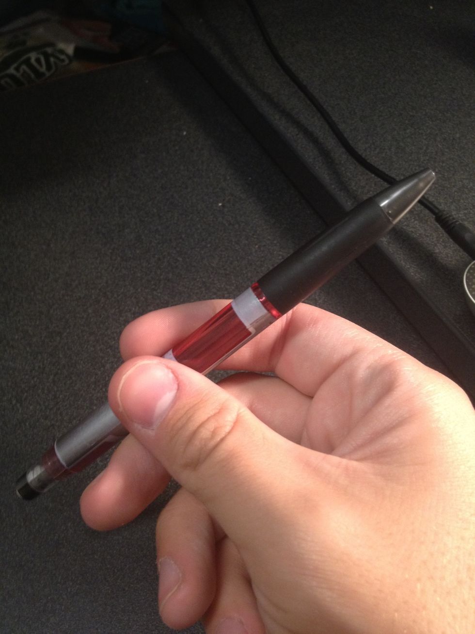 If spun with the proper motion, the pencil should make one full rotation and land and seen above, directly in your fingers without them moving.