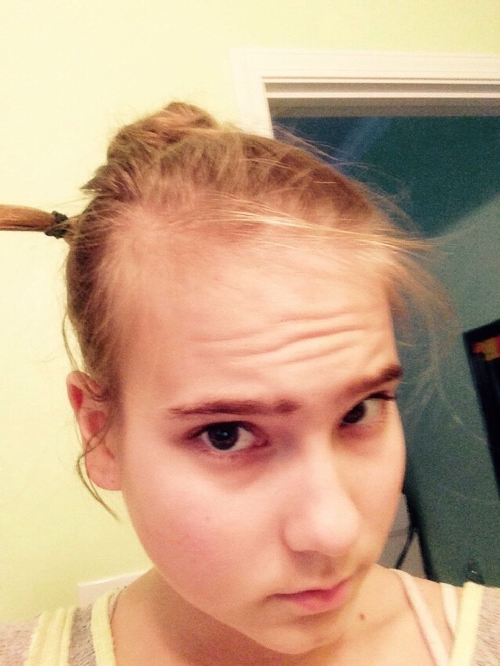 If the hair elastic isn't fully hidden ...
